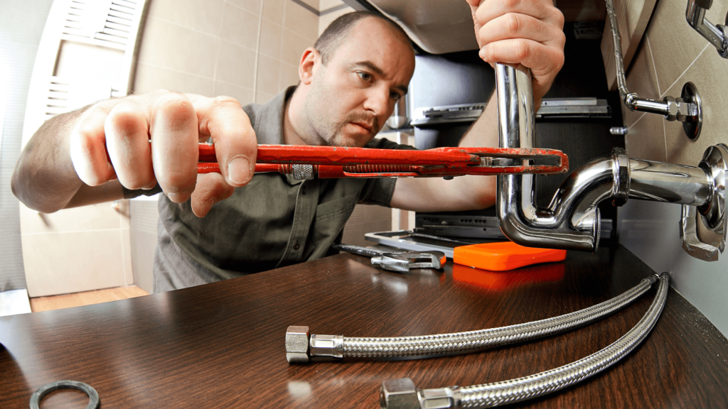 plumber under sink